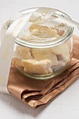 Shortbread biscuits in storage jar with Christmas ribbon