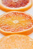 Slices of three different oranges (close-up)