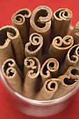 Several cinnamon sticks in glass (close-up)