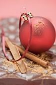 Christmas bauble and cinnamon on chocolate