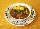 Chick-pea stew with potatoes in soup bowl
