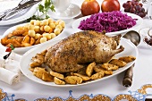 Roast duck with apples, red cabbage and potatoes
