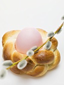 Easter egg in bread wreath with pussy willow