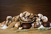 Bread still life with cereals, flour and butter