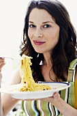 Woman eating spaghetti