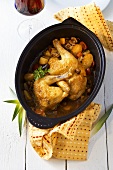 Chicken with vegetables in cast-iron casserole
