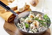 Pan-cooked scampi, mushrooms and onions