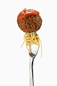 Pasta and Meatball on a Fork; White Background