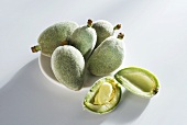 Fresh almonds, one halved