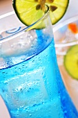 Blue soda water with lime on ice