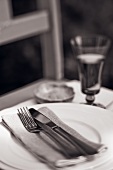 Place-setting and glass of wine