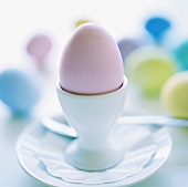 Coloured egg in eggcup