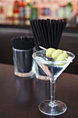 Dry Martini with olives in a bar