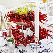 Crayfish on tiered stand on laid table (Sweden)