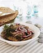 Fried herrings with red onions