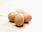 Four hens' eggs
