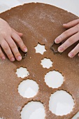 Children cutting out Christmas biscuits