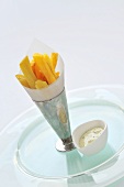 Chips in a paper cone with herb mayonnaise dip
