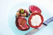 Mangosteen, partly peeled