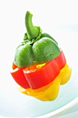 Pieces of red, yellow and green pepper, stacked