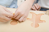 Children cutting out biscuits