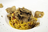 Passatelli (Parmesan pasta with bacon and truffles, Italy)