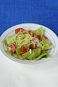 Romaine lettuce with tomatoes and pine nuts