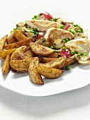 Potato wedges with chicken breast and vegetables