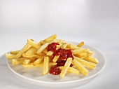 Chips with ketchup on plate