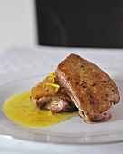 Fried duck breast with orange sauce