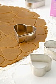 Cutting out heart-shaped ginger biscuits