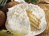Coconut cake with a piece removed