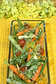 Dish of vegetables with herb dressing