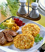 Fried duck breast with red wine sauce and ham rösti