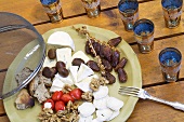Cheese plate with dates, nuts and bread