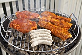 Sausages and meat on a barbecue