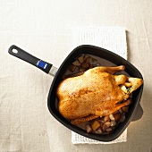 Stuffed duck in a frying pan