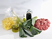 Ingredients for a pasta dish with leeks and mince