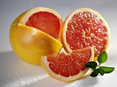 Grapefruit with a wedge removed and slices of grapefruit