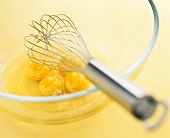 Whisking eggs in a glass bowl