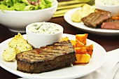 Beef steak with butternut squash, creamed spinach and dill potatoes