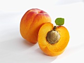 Whole and half apricot