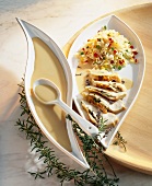 Spring chicken breast with a creamy sauce and vegetable rice
