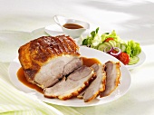 Roast pork with gravy and salad