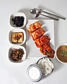 Homemade Kimchi with Traditional Korean Side Dishes Including Rice