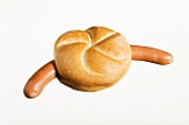 Bockwurst (German sausage) in bread roll