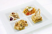 Various pasta dishes on an appetiser plate