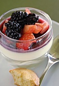 Panna cotta with berry sauce in a glass