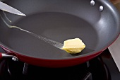 Melting butter in a frying pan