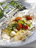 Fish fillet and vegetables cooked in roasting bag